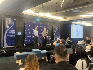 An ongoing class at the Gonstead Seminar in Australia, with chiropractors attentively listening to the speaker